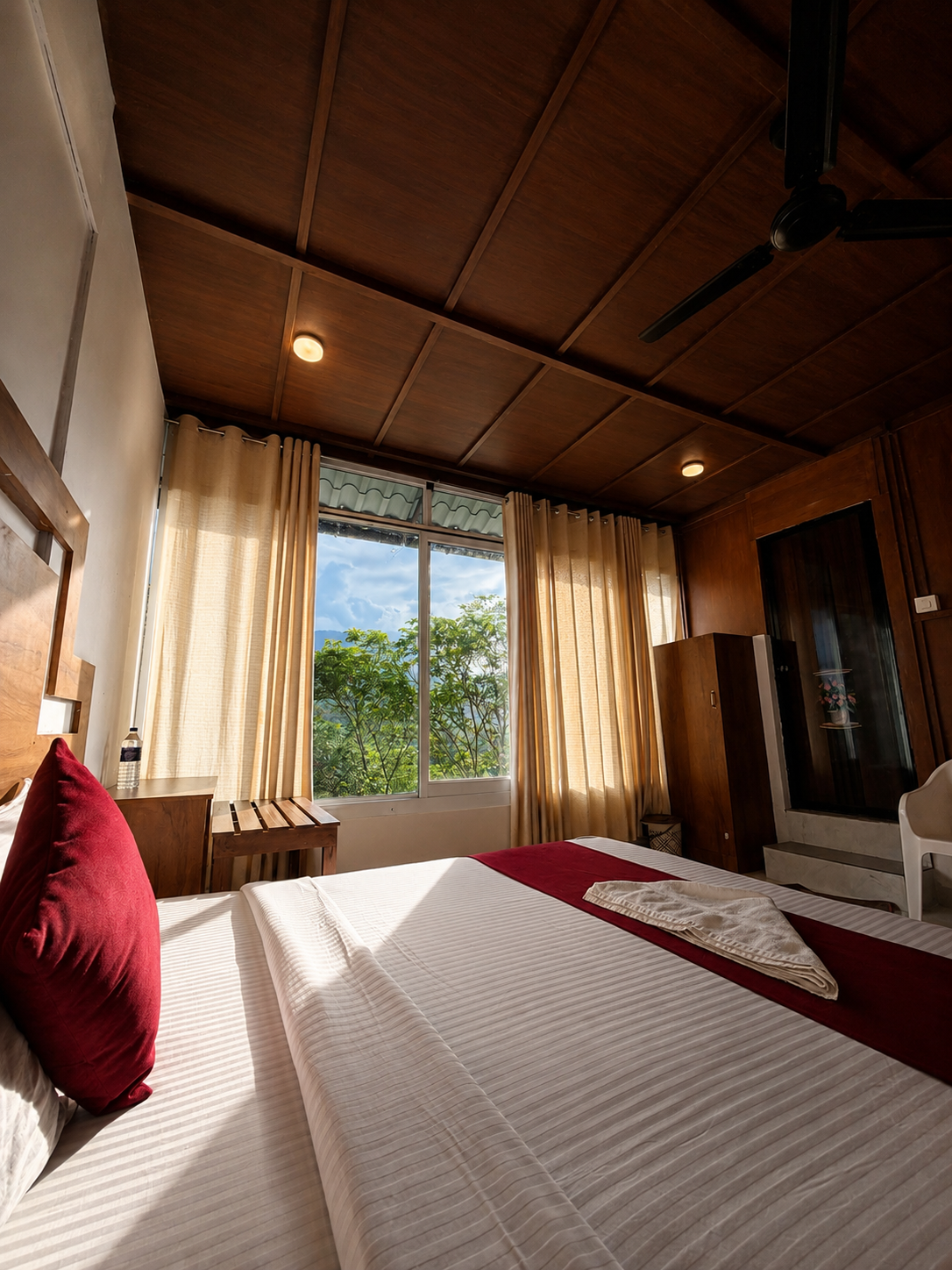 Cosy A-frame bedroom with a hill-facing window