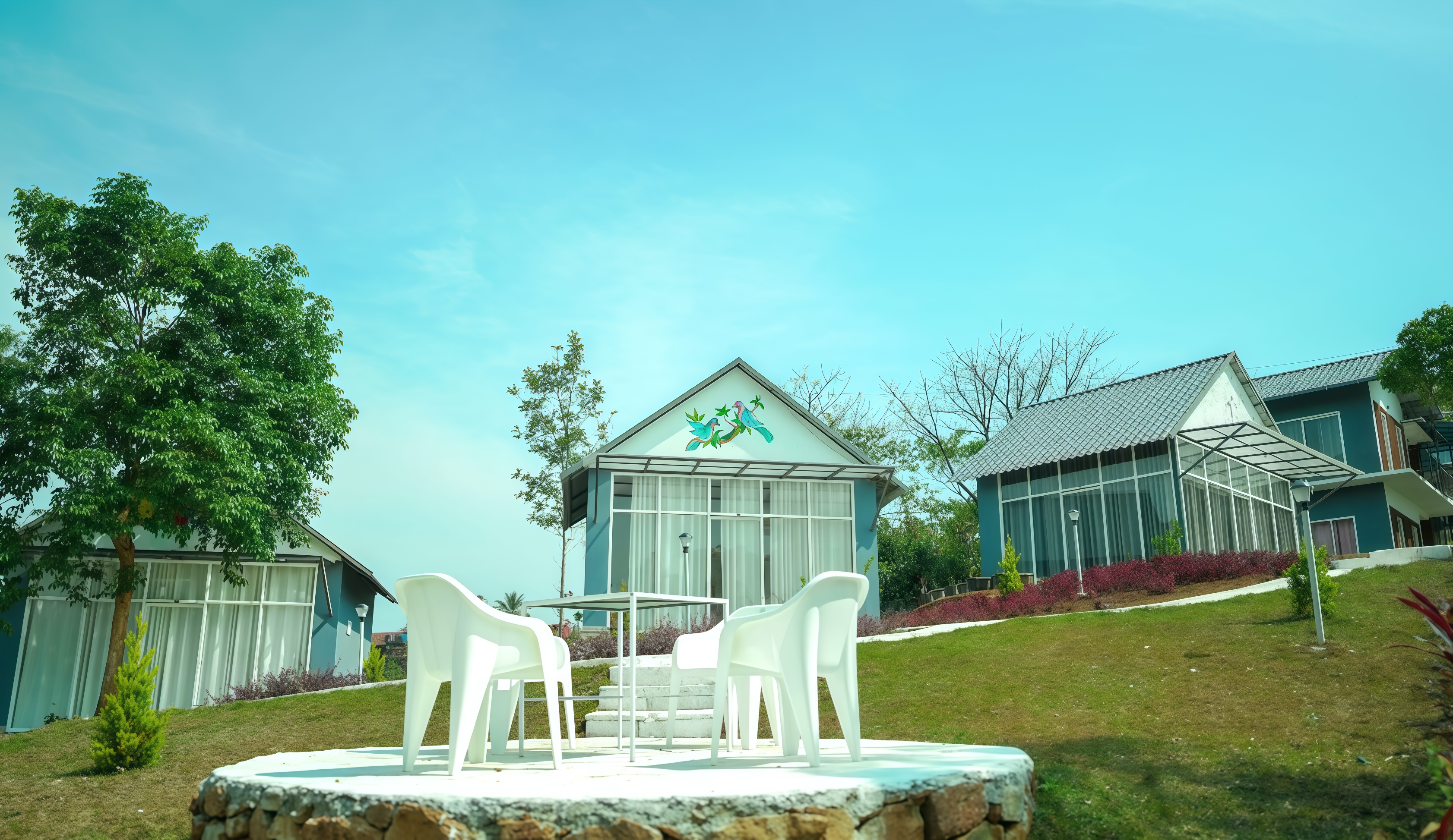 A private glass-fronted villa at sunset
